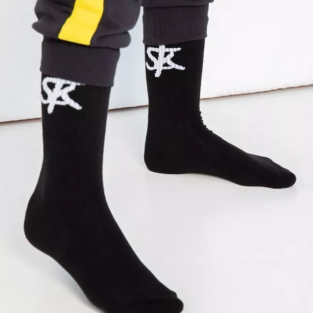 Sofa Killer juodos kojinės su baltu SK logotipu